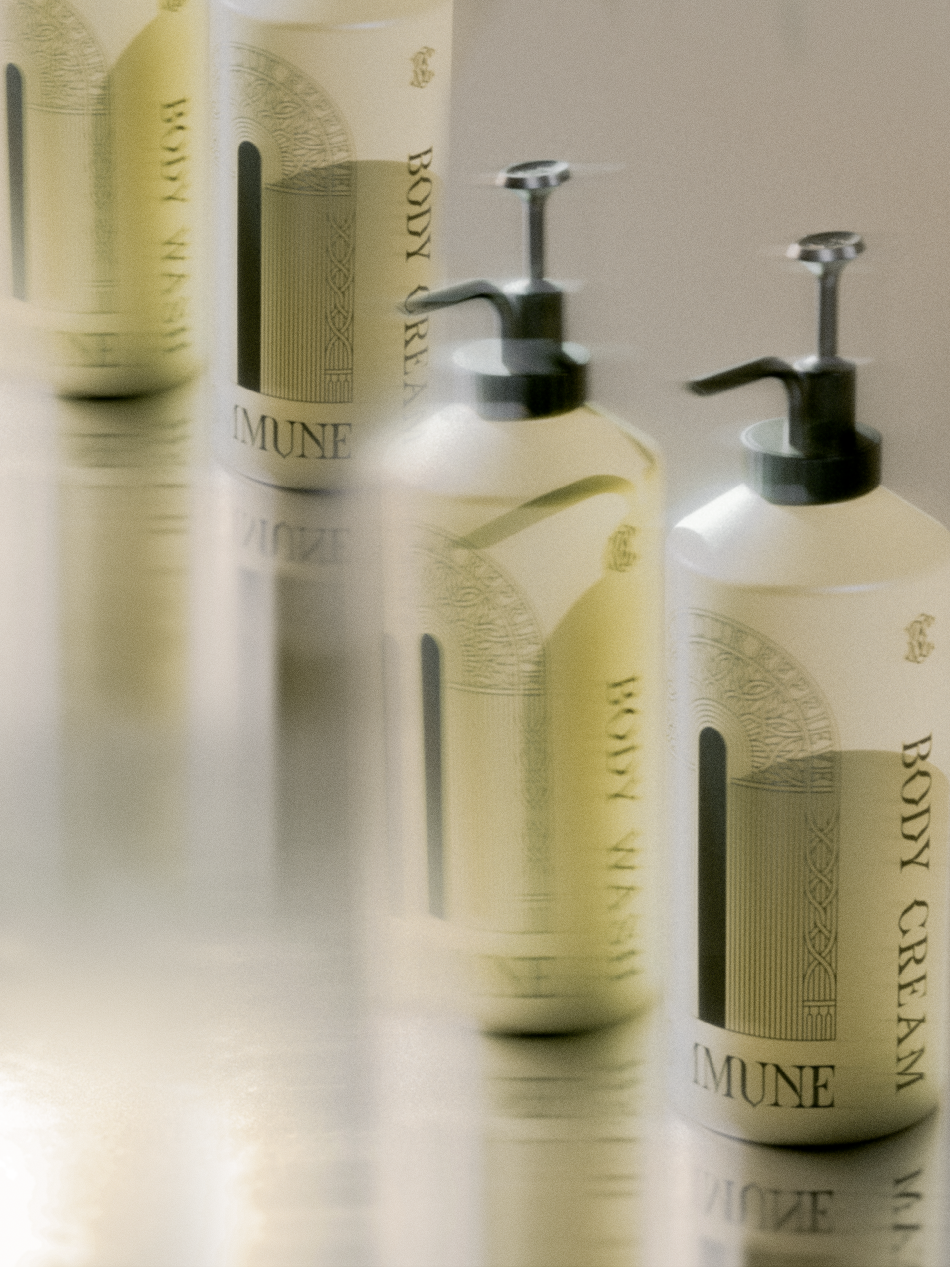Commune body duo consisting of body cream and body wash with pump dispensers on a reflective surface.