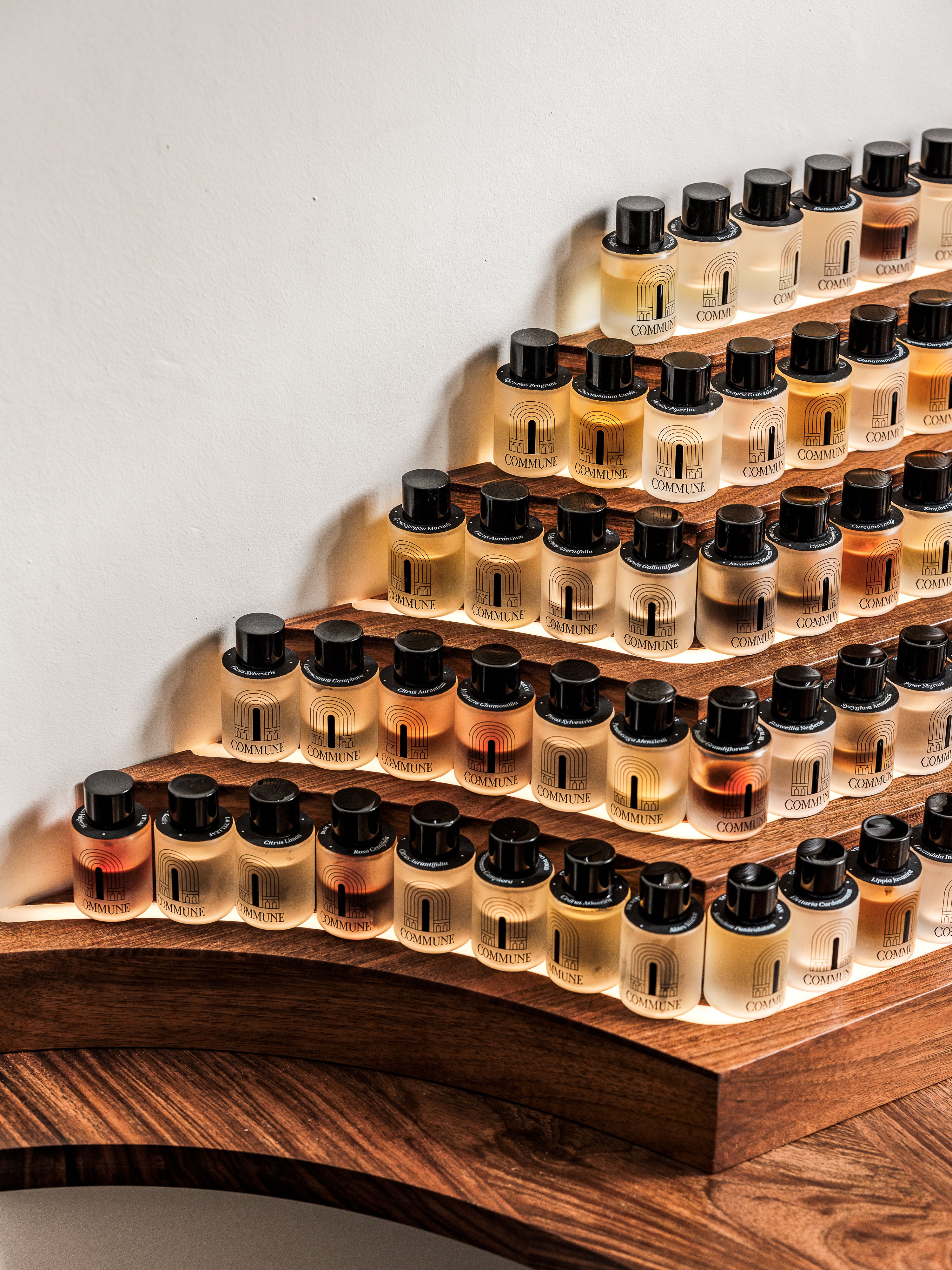 Commune fragrance organ with natural scents in  bottles on a white background