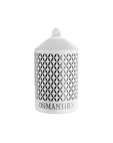 A white Osmanthus Lux candle with a geometric pattern, in an aluminum container with a white onyx  lid.