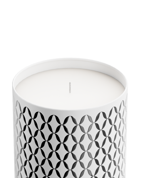 A Nymphea Lux candle with a geometric pattern printed on it.