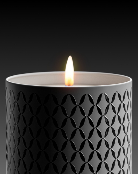 A Nymphea Lux candle with a geometric pattern printed on it.