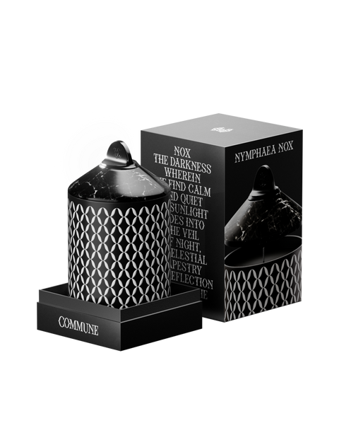 Nymphea Nox candle in an aluminum vessel with a geometric pattern, with a black marble lid.