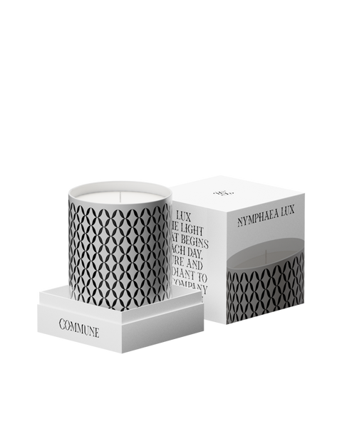 A Nymphea Lux candle with a geometric pattern printed on it.