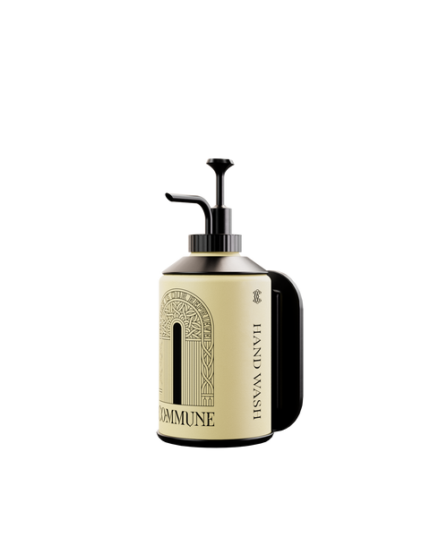 A wall bracket designed for mounting a 500ml bottle, made of robust, rust-resistant metal with a drainage hole at the bottom.