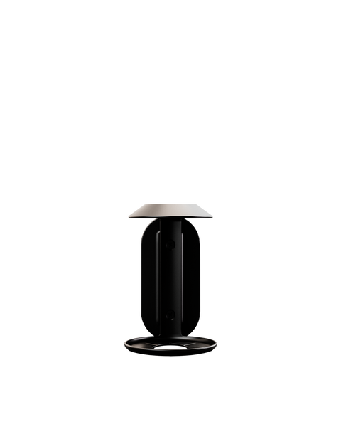 A wall bracket designed for mounting a 500ml Commune bottle