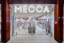 MECCA store entrance with glass door and illuminated sign commune stockist in australia