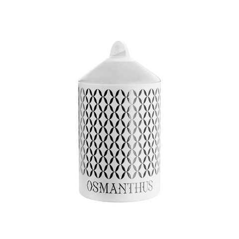 A white Osmanthus Lux candle with a geometric pattern, in an aluminum container with a white onyx  lid.