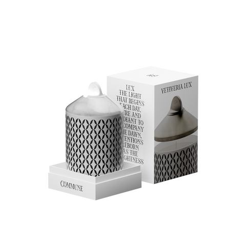 A luxury scented Vetiveria Now candle with a white onyx lid housed in a white aluminum vessel.