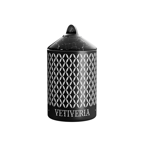 A luxury Vetiveria scented candle with a black and white geometric patterned cover.