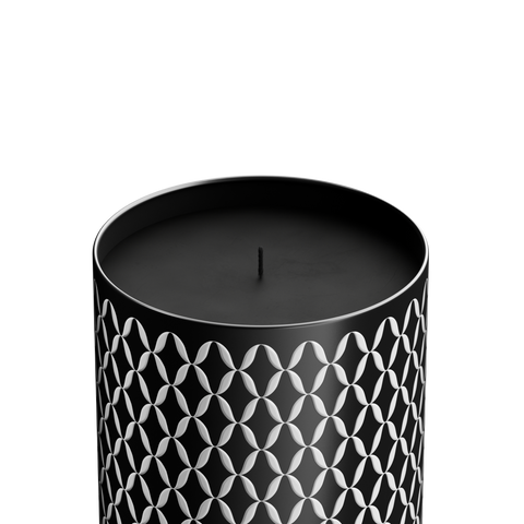A luxury Vetiveria scented candle with a black and white geometric patterned cover.